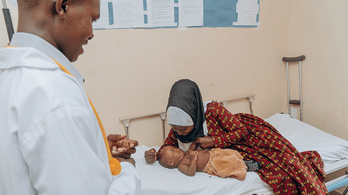 Healthcare worker supporting a community member